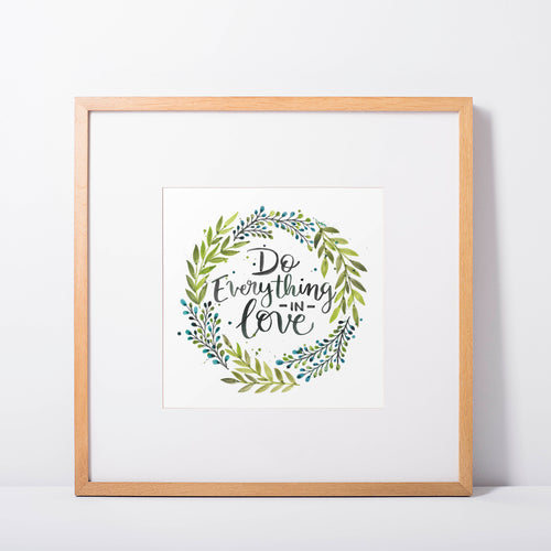 Do Everything In Love Watercolour hand lettered typographic quote surrounded by a wreath of green leaves