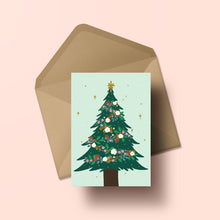Load image into Gallery viewer, A Christmas tree decorated with garlands of beautiful NZ flora with holly and bright stars, all set against a mint green background.